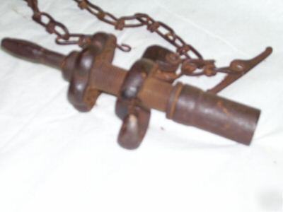 Antique cast iron drill bit valve with chain