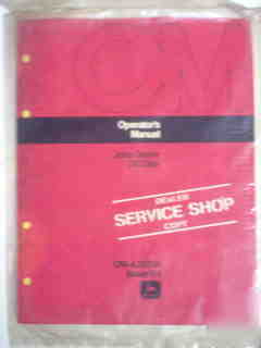 New john deere 310 disk operator manual- in plastic 